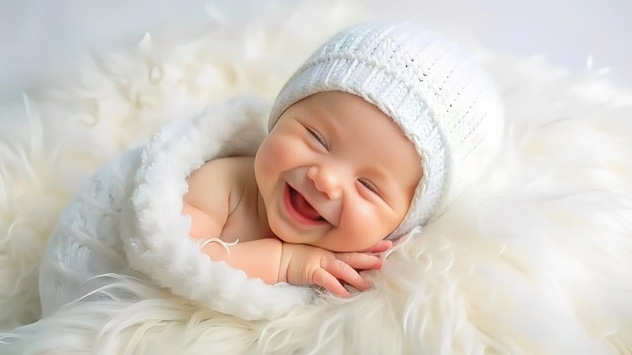 Smiling baby wrapped in a cozy