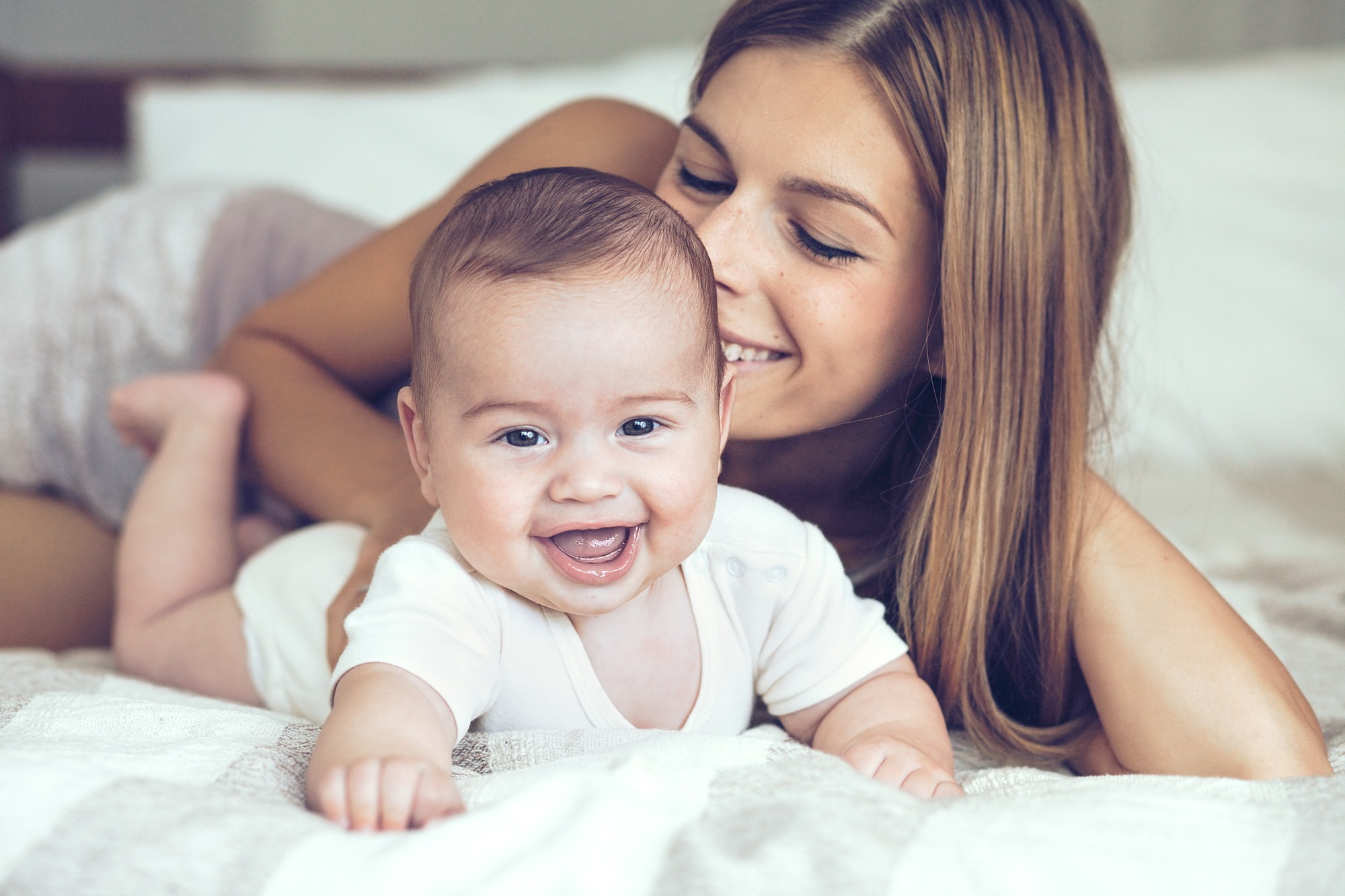Portrait of beautiful mother playing