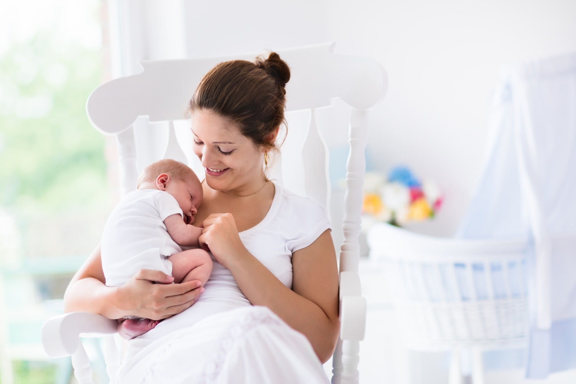 Young mother holding her newborn child