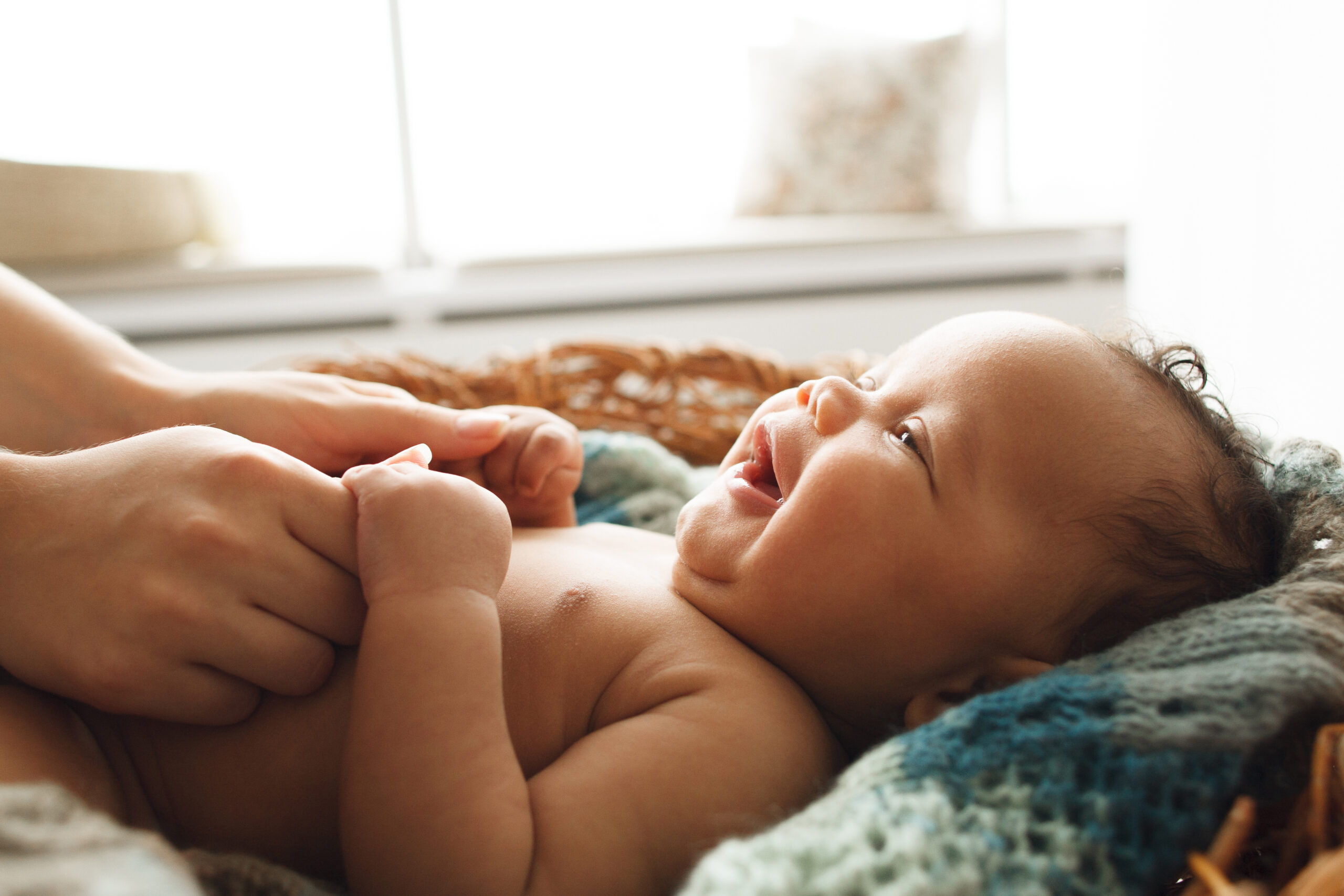 Baby smiling at mother